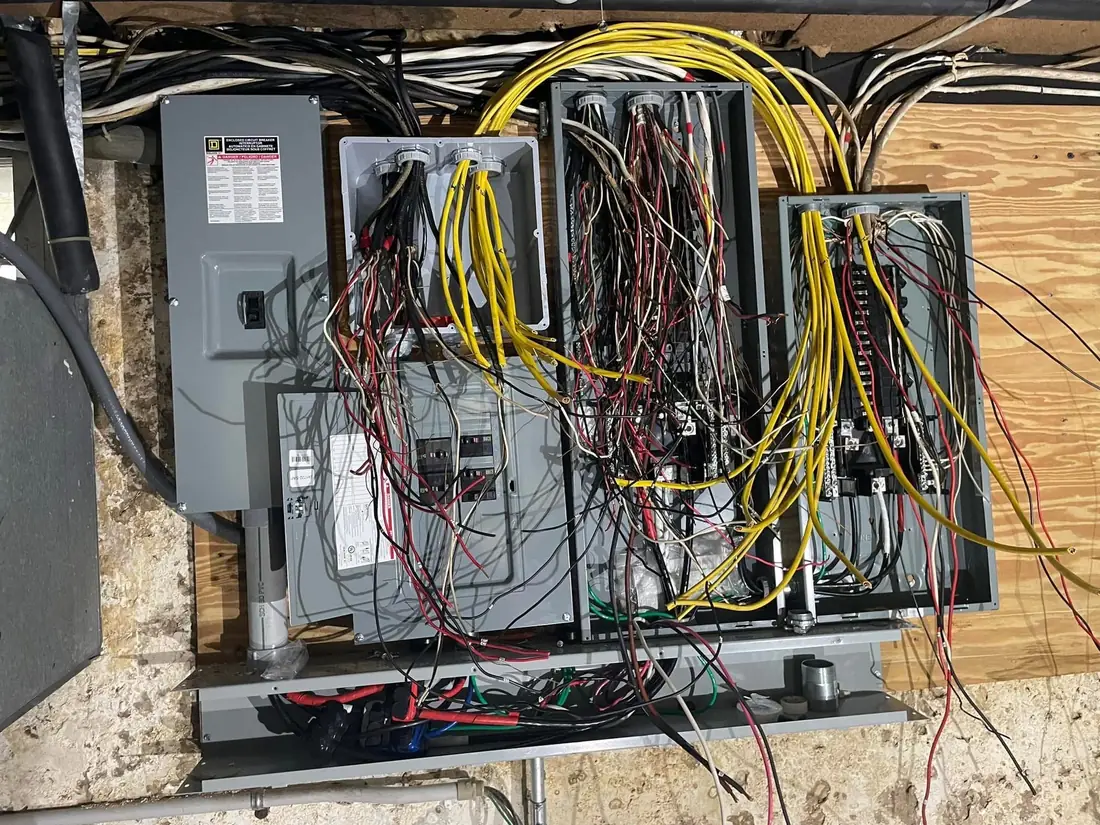 Commercial electrical panels with wiring bundles labeled for maintenance